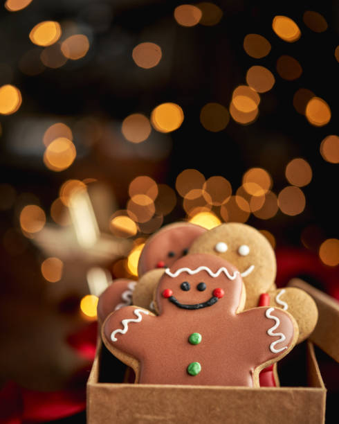 istock Decorated Gingerbread Man Christmas Cookies on Christmas Background 1760301449