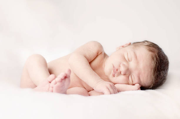 istock Newborn Baby Boy Sleeping Peacefully 176030147