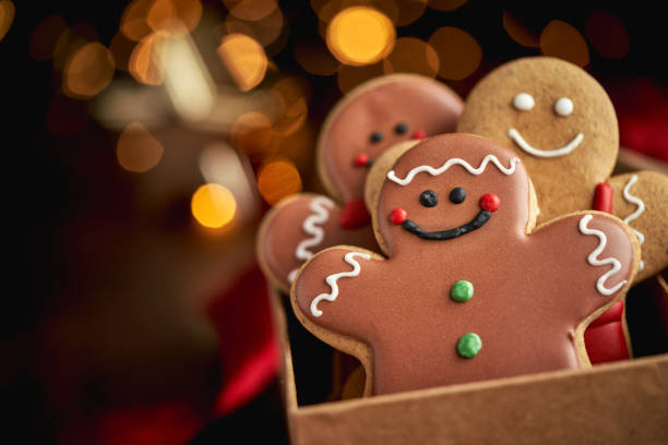istock Decorated Gingerbread Man Christmas Cookies on Christmas Background 1760301823