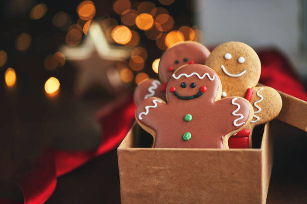 istock Decorated Gingerbread Man Christmas Cookies on Christmas Background 1760301956