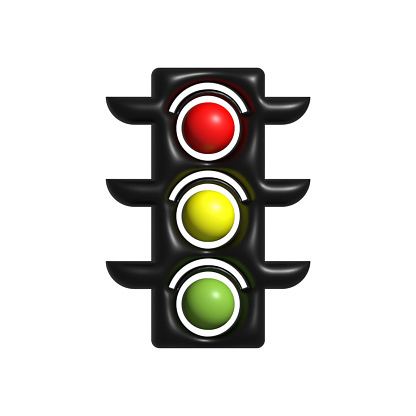 Toy traffic light over white background showing green yellow and red
