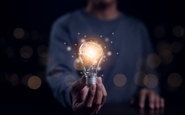 istock New idea innovation concept, Man holding Light bulbs with Brain inside and digital connection line. Creative and innovation inspiration. Idea and imagination, Business Bright idea, Science innovation, 1760312409