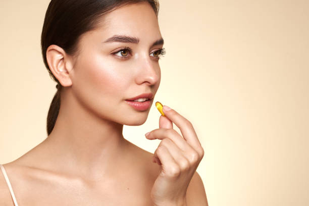 istock Beautiful Girl With Pill With Cod Liver Oil Omega-3 1760336902