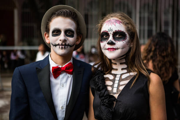 Portrait of a young couple dressed up for celebration of the Day of the Dead. Morelia, Michoacan State, Mexico.