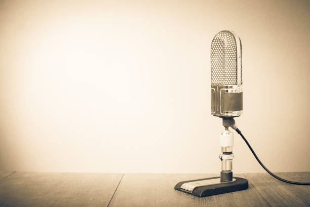 Retro microphone for press conference or interview. Vintage old style sepia photo stock photo