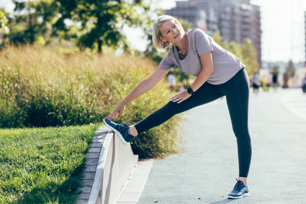 istock Warm Up Exercise: Senior Woman Stretching Before Her Outdoors Training 1760412667