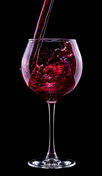 istock Elegant red wine glass in black background 176041838
