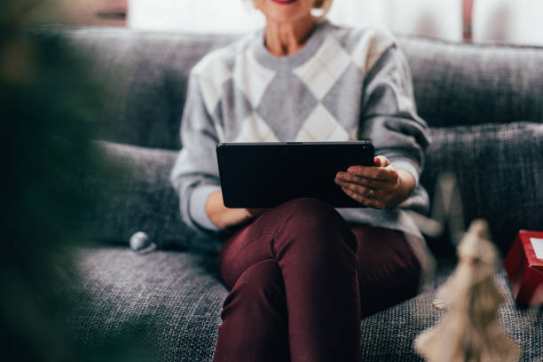istock Tablet in Hand: Senior Woman's Online Christmas Shopping 1760419485