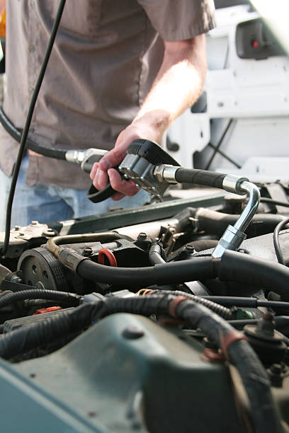 istock Mechanic Dispensing Motor Oil 176042047