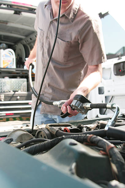 istock Mechanic Dispensing Motor Oil 176042050