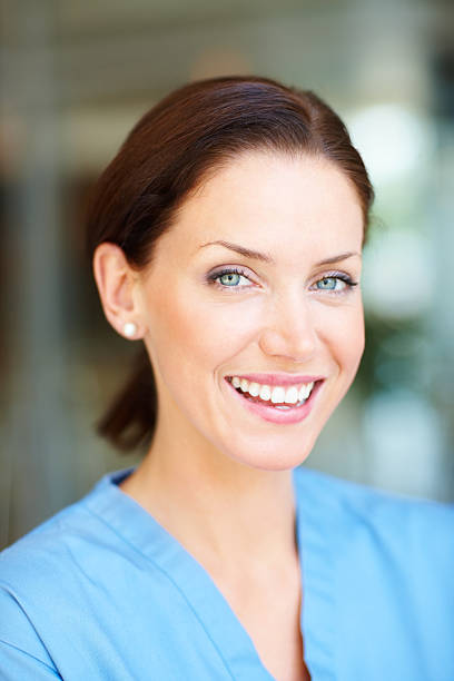 istock Closeup of a young  nurse smiling 176042111