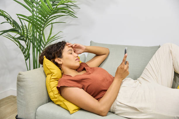 istock Sad young latin teenage girl with anxiety problems using mobile phone 1760424287