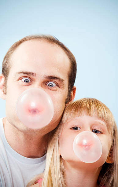 Bubble Gum Man and Girl Child  Fun stock photo