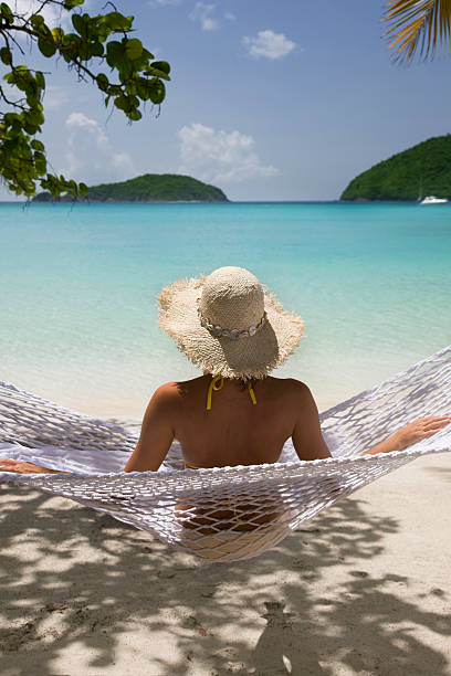 istock woman in a beach hammock 176043039