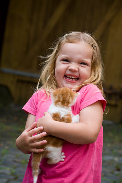istock Little girl and cat 176043510