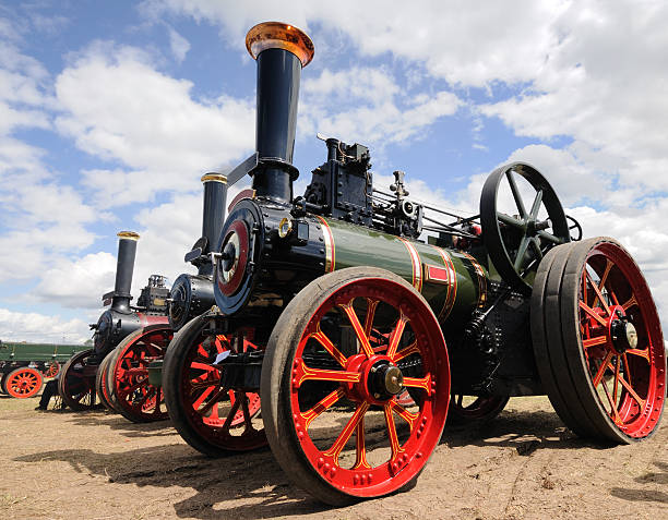 Traction Engines Line of traction engines at a steam rally in the English Midlands. road going steam engine stock pictures, royalty-free photos & images
