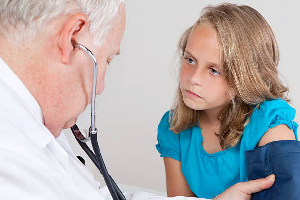 Doctor Measuring Blood Pressure stock photo