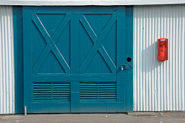 istock Fishing net shed doors and fire extinguisher 176045546