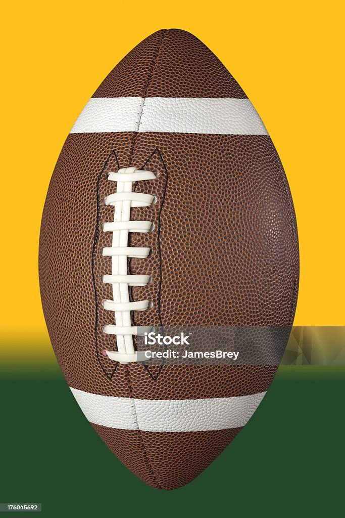 Football With Clipping Path on Colorful Background Generic American football with hand-made clipping path on colorful background.  The clipping path enables you to delete the background or fill it with any image or team colors you choose. American Culture Stock Photo