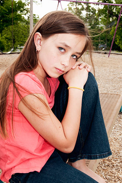 istock Sad Girl at the Playground 176045694
