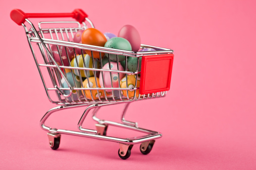 Colorful easter eggs in a shopping cart.
