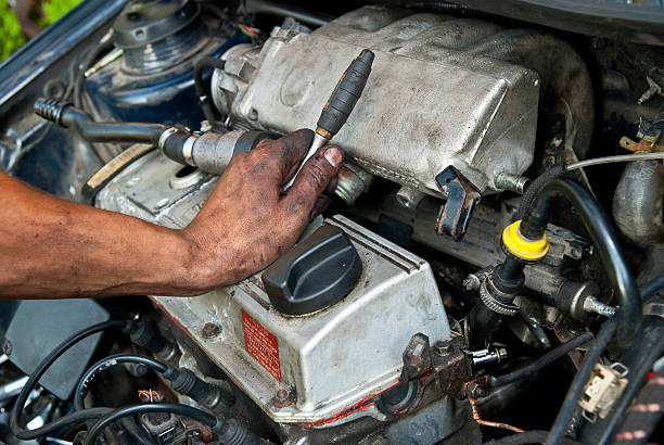 istock mechanican repairing the car 176046461