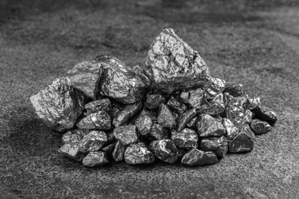 istock Pile of silver nuggets on grey textured table, closeup 1760474497