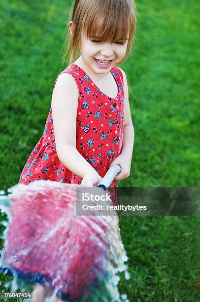 Playing With Water Stock Photo - Download Image Now - 4-5 Years, Assistance, Child