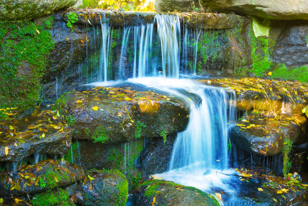 istock small closeup waterfall rushing over a stones 1760478730