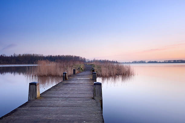 istock Boardwalk on a lake at dawn in The Netherlands 176048048