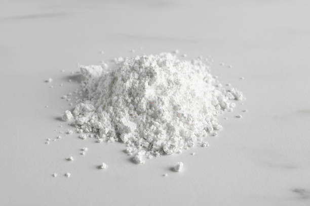 istock Heap of calcium carbonate powder on white table 1760486128