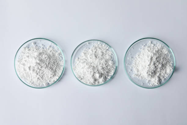 istock Petri dishes with calcium carbonate powder on white table, flat lay 1760487187