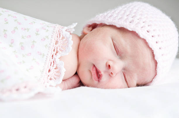 istock Sleeping Newborn Baby Girl with Pink Hat & Blanket 176049999