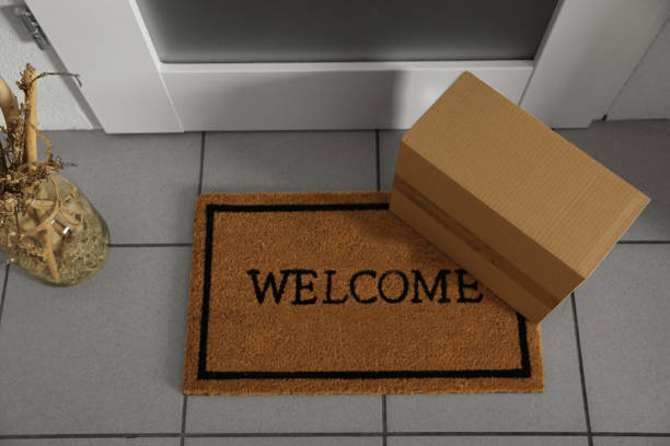 istock Parcel delivered on mat near front door, above view 1760500506
