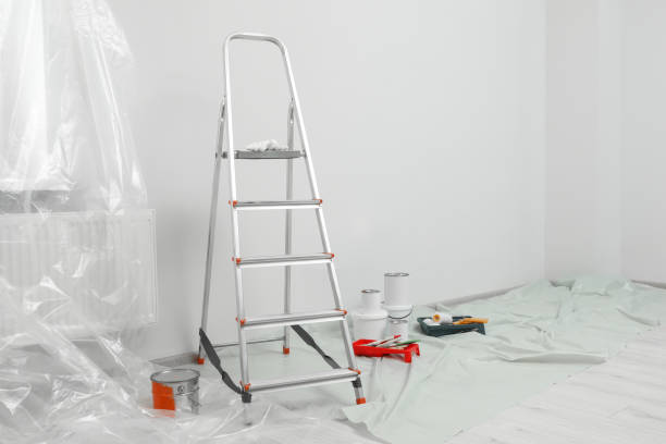 istock Metallic folding ladder and painting tools indoors 1760502645