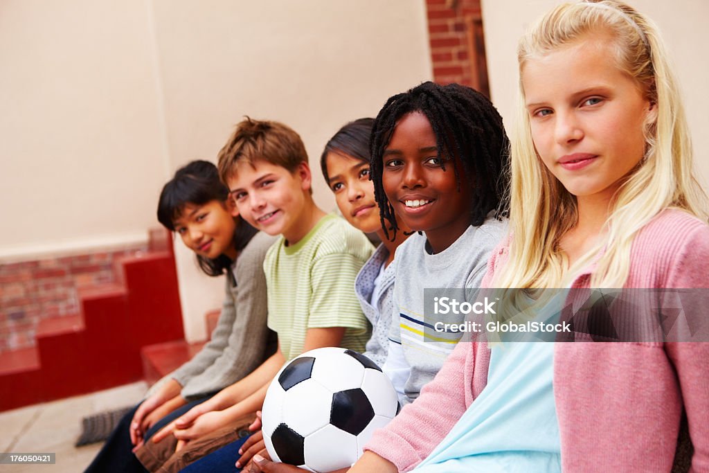 Niños y niñas de fútbol americano - Foto de stock de 10-11 años libre de derechos