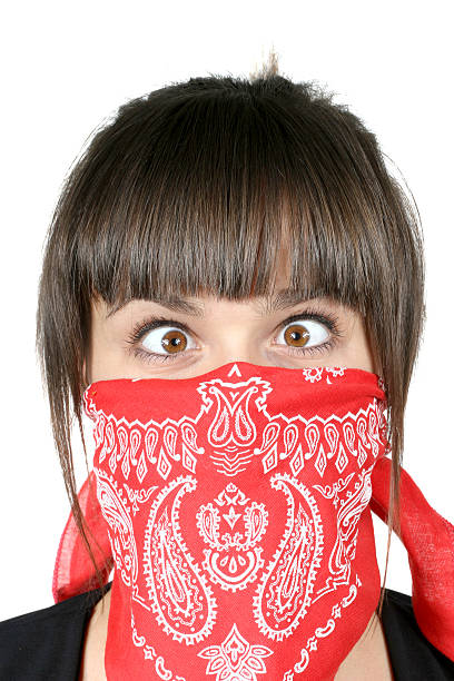 Funny rogue girl in red bandanna stock photo
