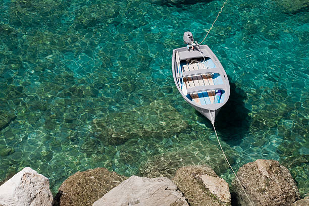 Boat in Turquoise Water stock photo
