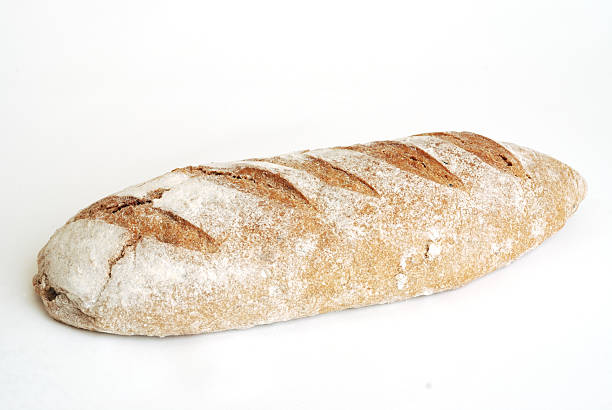 oblong artisan loaf of bread stock photo
