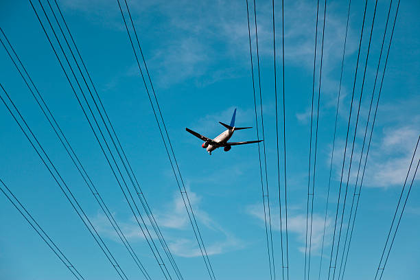 istock airplane and power cable in the sky 176051936