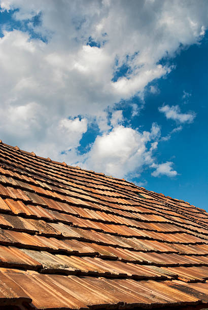 istock Roof and sky with clouds 176052806