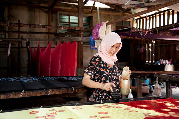 Malaysia, making batik, colorful clothes.  malaysia batik pattern stock pictures, royalty-free photos & images
