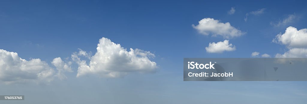 Clouds and Sky Panoramic of nice cloud formations in a blue sky. Stitch of 6 different shots.All clouds images: Backgrounds Stock Photo