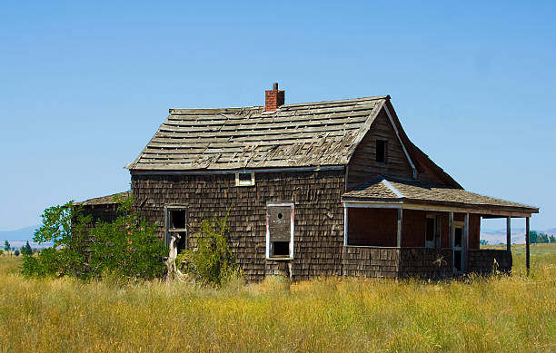 istock Abandoned house in field 176053766
