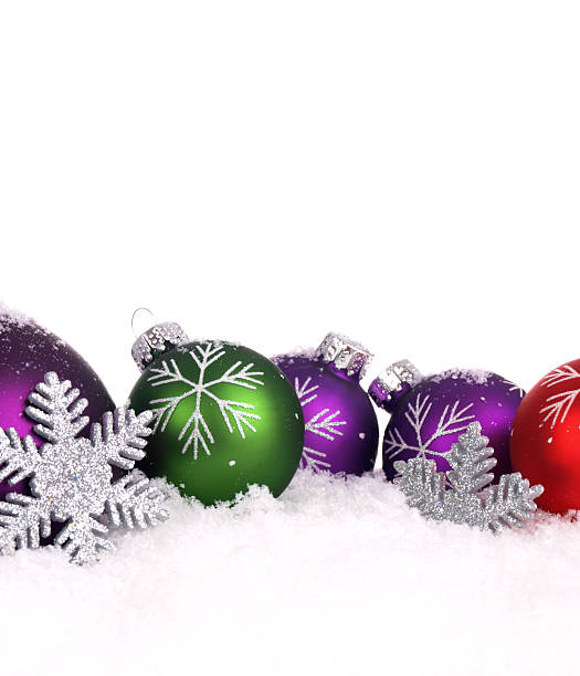 istock Five Colorful Christmas Baubles in Snow 176053962