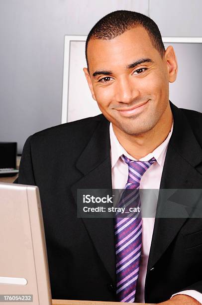 Smiling Businessman With Computers Stock Photo - Download Image Now - 20-29 Years, 25-29 Years, Adult