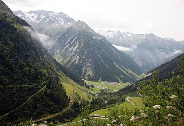 Zillergrund view "View on the Zillergrund area in Tirol (Austria) as seen from the Zillergrund dam. Snowcapped mountains in the background. Taken on a cloudy day, summer of 2009.Canon 1Ds Mark III + 24 mm @ ISO 250, slightly cropped & downsizedsimilar images :" zillertaler alps stock pictures, royalty-free photos & images