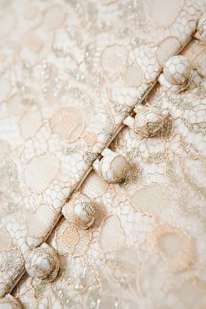 Button on a bodice of a wedding dress