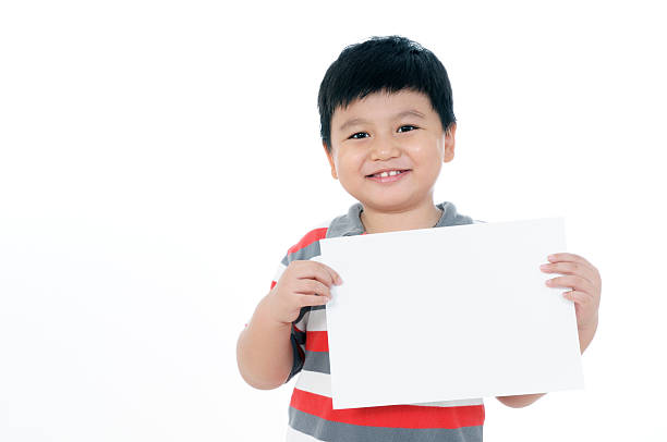 istock Happy young boy holding blank card 176054485