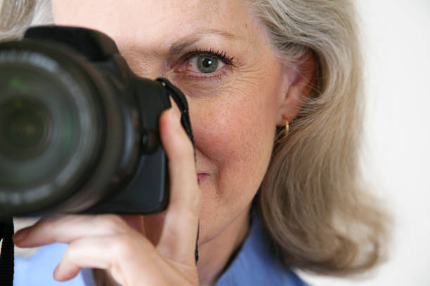 istock Female Photographer Using Her Digital SLR 176054560